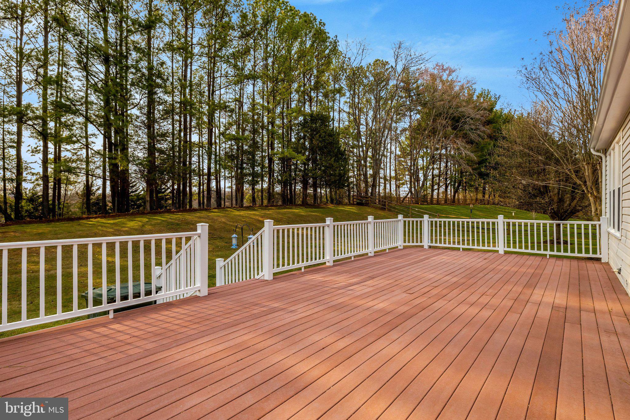 1398 Park Lake Drive Reston, VA 20190 - Photo 50 of 64 a view of a deck with a large trees with wooden fence