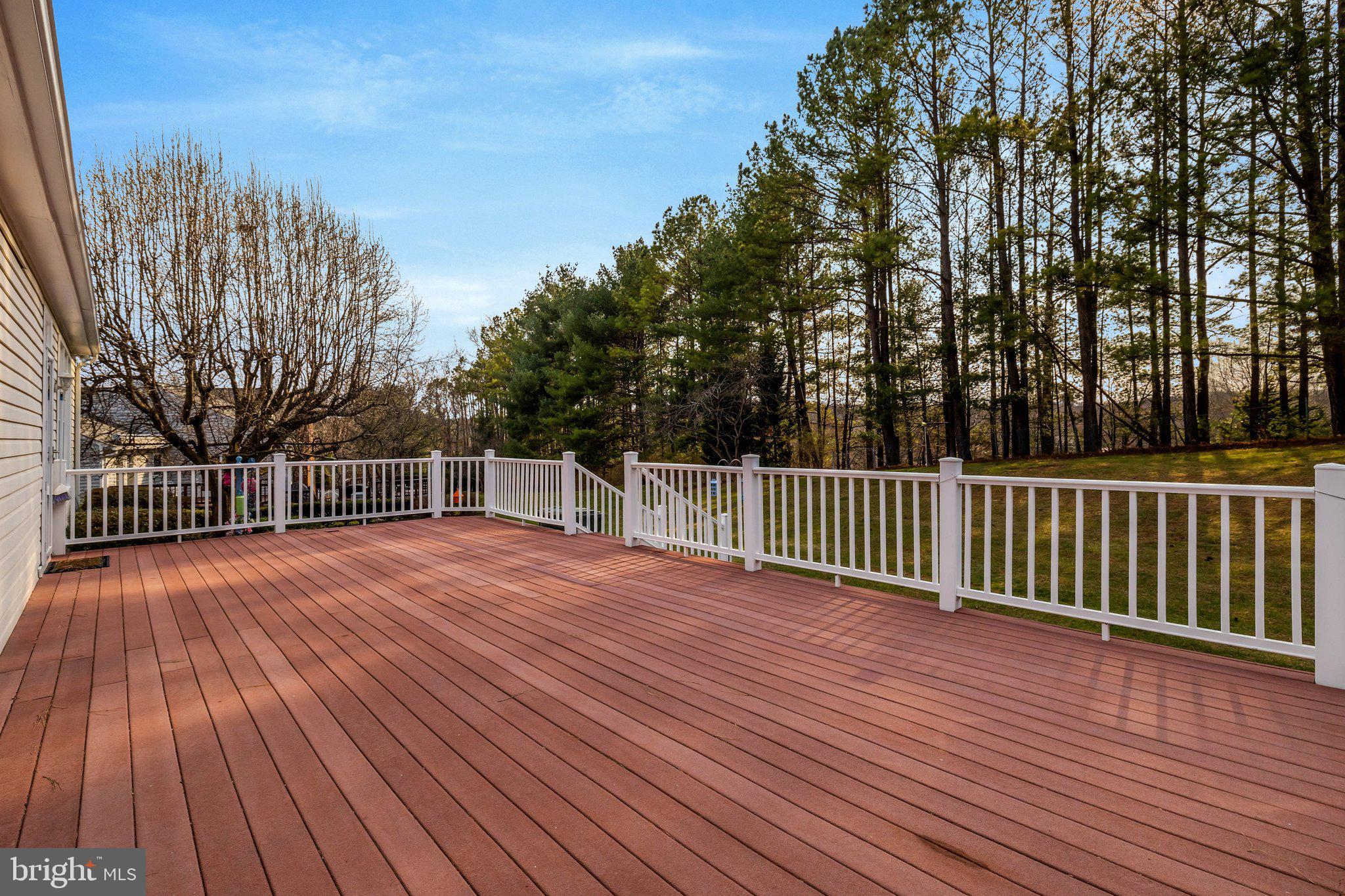 1398 Park Lake Drive Reston, VA 20190 - Photo 51 of 64 a view of a deck with wooden floor and fence with a large garden space