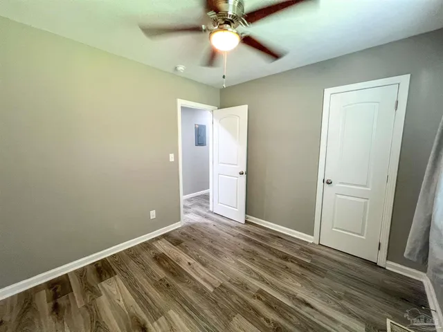 a view of room with window and ceiling fan