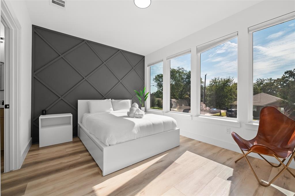 2701 Birmingham Avenue Dallas, TX 75215 - Photo 10 of 21 a bedroom with a bed and a large window