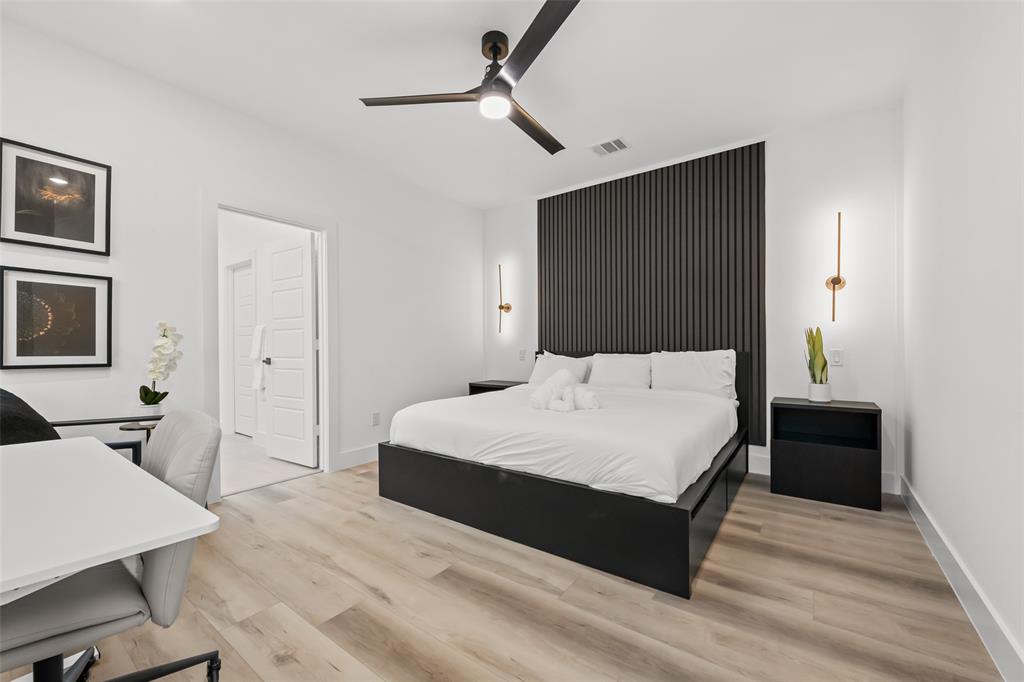 2701 Birmingham Avenue Dallas, TX 75215 - Photo 15 of 21 a bedroom with a bed and a table