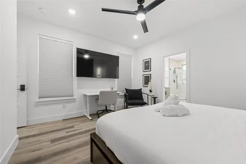 a bedroom with a bed and a table