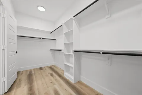 a bathroom with a double vanity sink toilet and shower