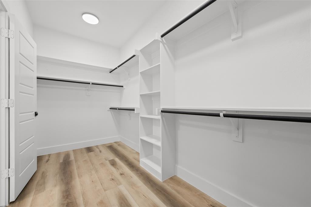 2701 Birmingham Avenue Dallas, TX 75215 - Photo 18 of 21 a view of walk in closet with empty racks