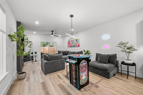 a kitchen with stainless steel appliances a sink dishwasher a stove top oven a refrigerator with island and cabinets