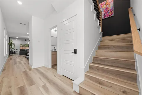 a bathroom with a sink toilet and a mirror