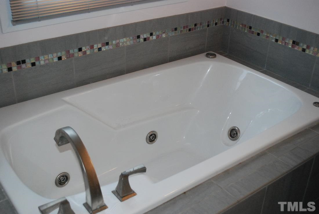 610 Manor Ridge Road Carrboro, NC 27510 - Photo 15 of 24 The jetted bathtub completes the spa atmosphere of the master bath.