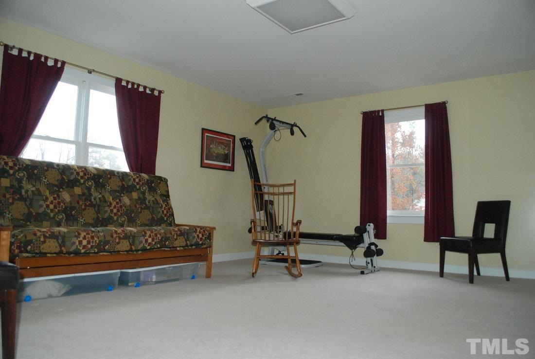 610 Manor Ridge Road Carrboro, NC 27510 - Photo 17 of 24 Large windows on three walls make this space bright.