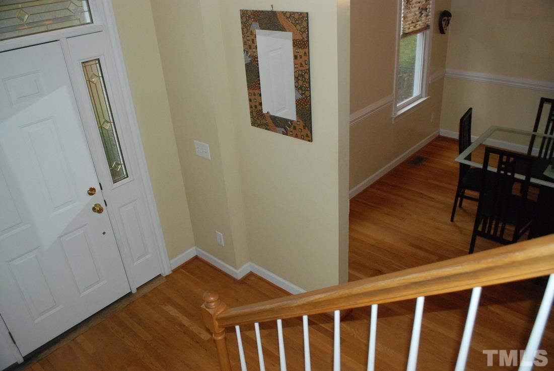 610 Manor Ridge Road Carrboro, NC 27510 - Photo 3 of 24 A large window and decorative sidelights around the front door provide a warm welcome.