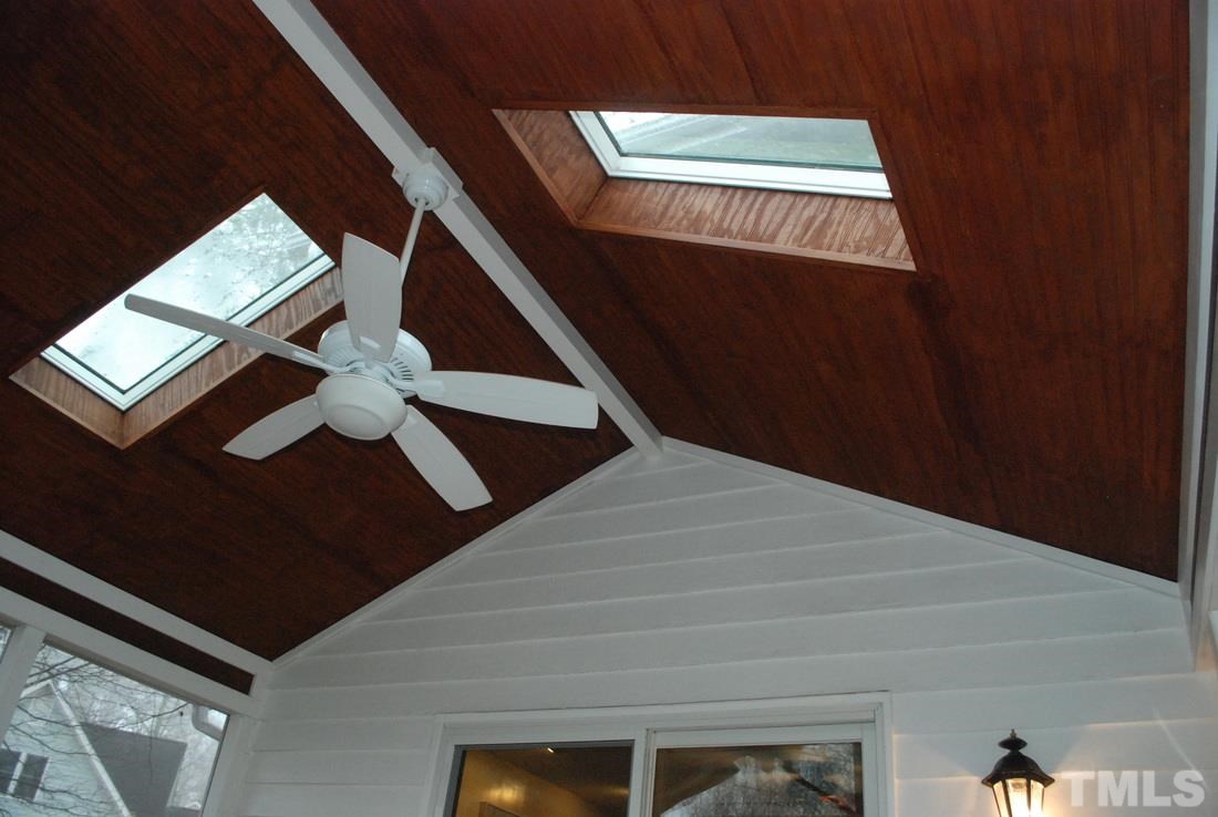 610 Manor Ridge Road Carrboro, NC 27510 - Photo 21 of 24 The cathedral screened porch ceiling has skylights and gorgeous wood.