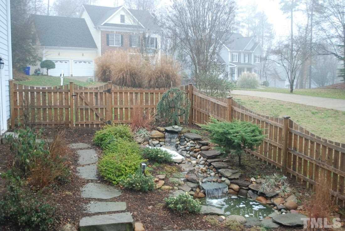610 Manor Ridge Road Carrboro, NC 27510 - Photo 23 of 24 A custom water feature provides a relaxing atmosphere to this backyard.