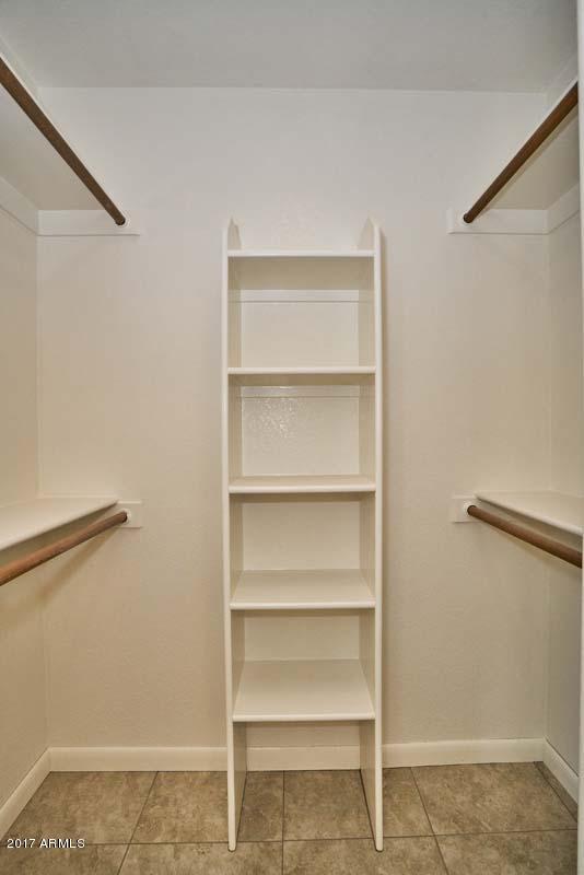 304 West Colt Road Tempe, AZ 85284 - Photo 23 of 28 a view of walk in closet with empty racks