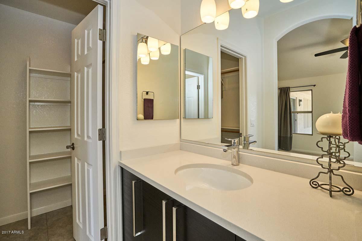 304 West Colt Road Tempe, AZ 85284 - Photo 5 of 28 a bathroom with a sink and a mirror