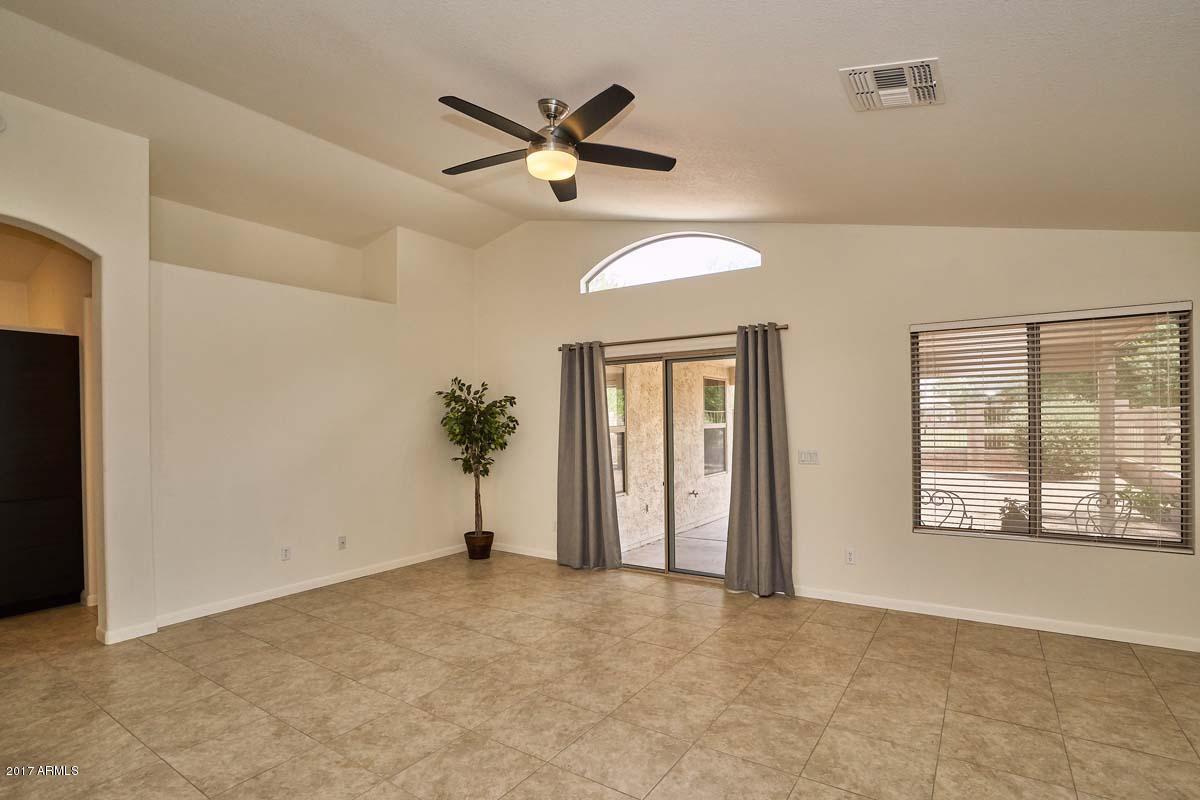 304 West Colt Road Tempe, AZ 85284 - Photo 10 of 28 an empty room with ceiling fan and window
