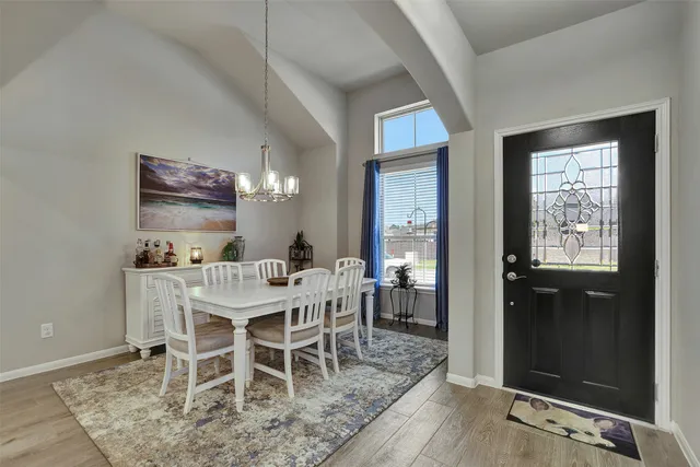 a view of a dining room with furniture