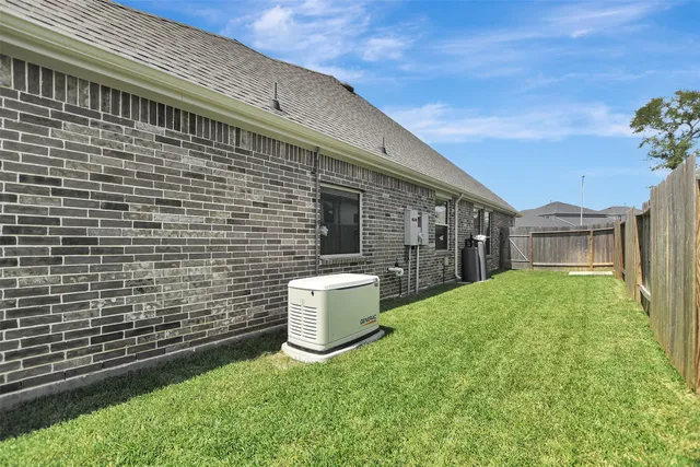 a brick building with a yard