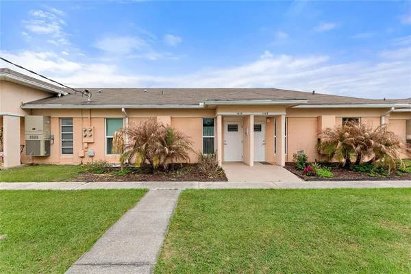 front view of a house with a yard