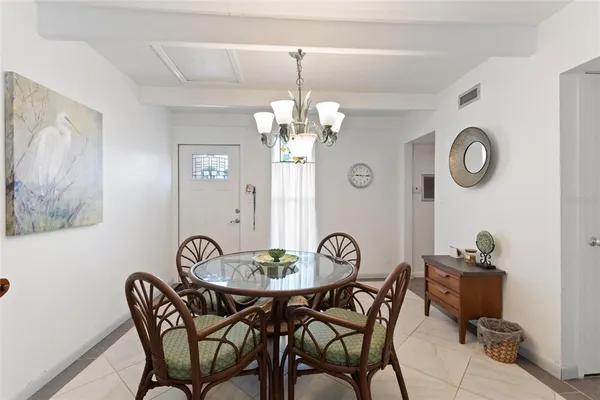 a view of a dining room and chandelier