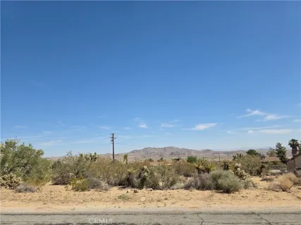a view of a mountain with sunset view