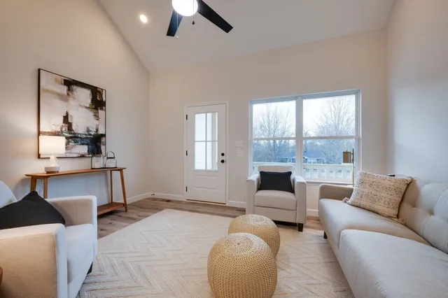 a living room with furniture and a large window