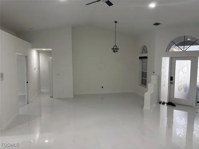 a view of a room with a hallway