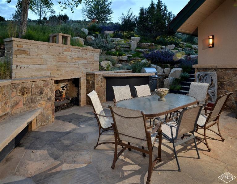 141 Mesquite Drive Edwards, CO 81632 - Photo 13 of 17 a view of a patio with table and chairs with wooden floor and fence