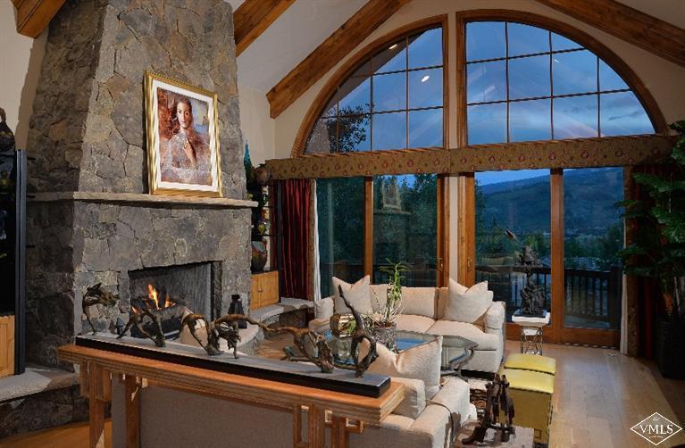 141 Mesquite Drive Edwards, CO 81632 - Photo 3 of 17 a living room with furniture a fireplace and floor to ceiling window