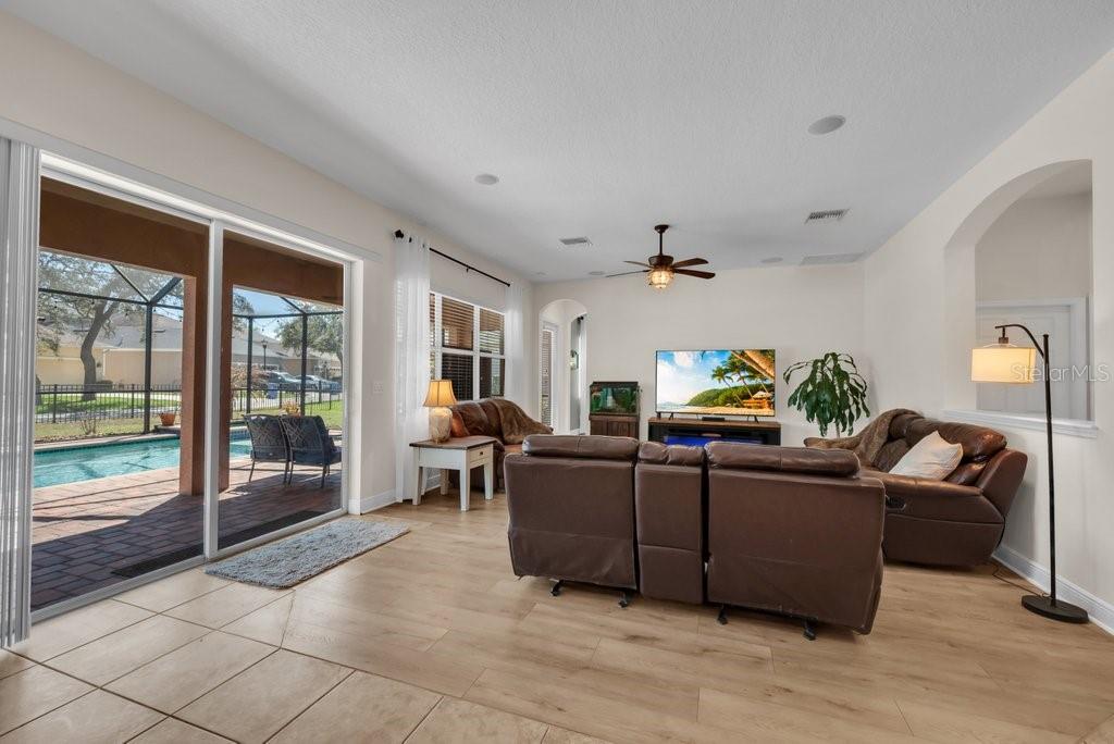 5920 Fishhawk Crossing Boulevard Lithia, FL 33547 - Photo 17 of 61 a living room with furniture and a flat screen tv