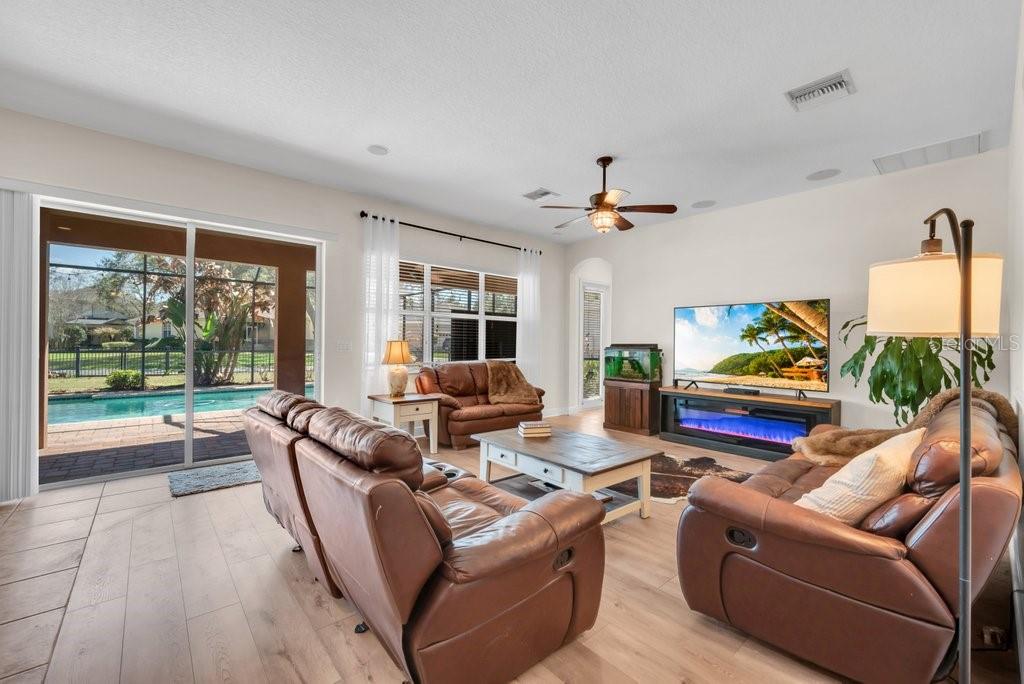 5920 Fishhawk Crossing Boulevard Lithia, FL 33547 - Photo 19 of 61 a living room with furniture and a large window