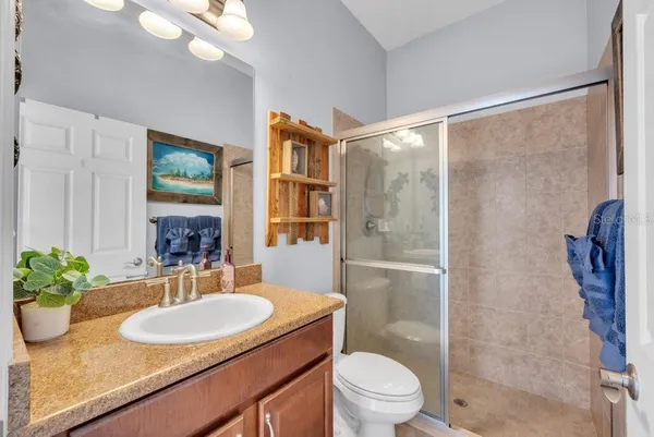 a living room with a couch and a chandelier
