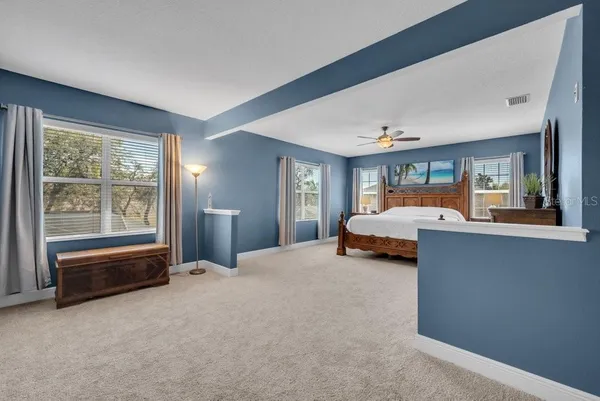 a bedroom with bed and window