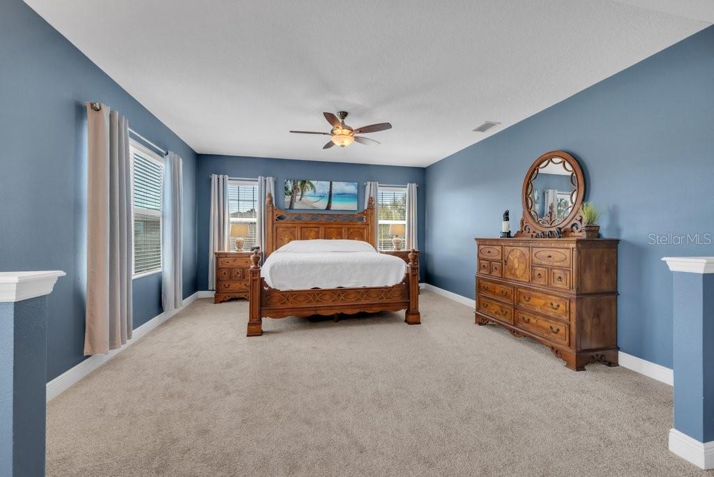 5920 Fishhawk Crossing Boulevard Lithia, FL 33547 - Photo 26 of 61 a bedroom with bed and window