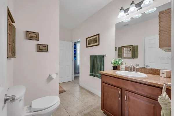 a bathroom with a sink a vanity and a mirror