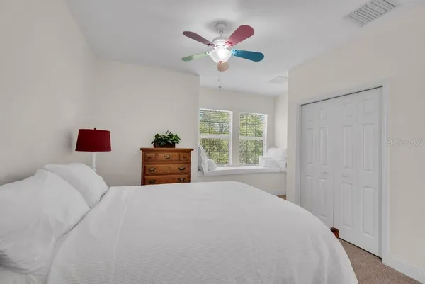 a view of a backyard with swimming pool