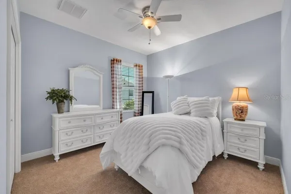 a view of a house with backyard sitting area and garden