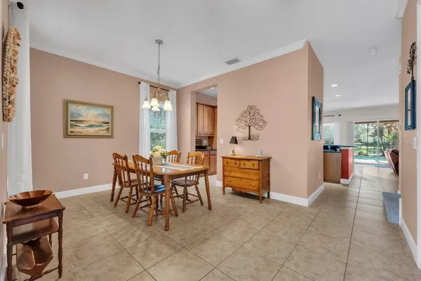 a dining room with furniture and window
