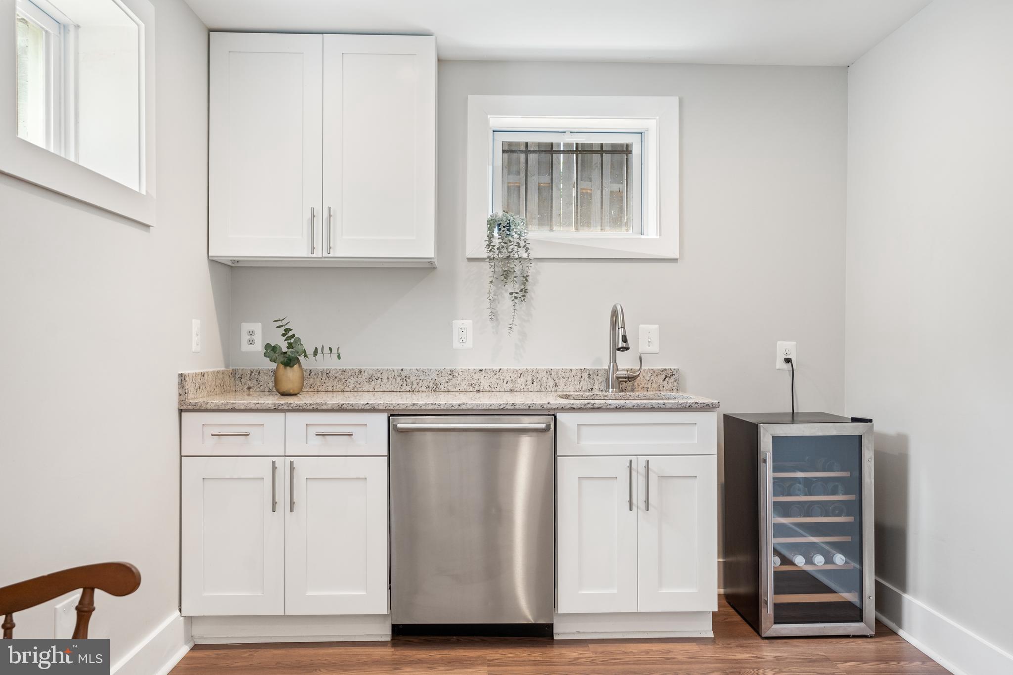 5221 C Street Southeast Washington, DC 20019 - Photo 24 of 34 SS sink, Electrolux dishwasher, and wine fridge