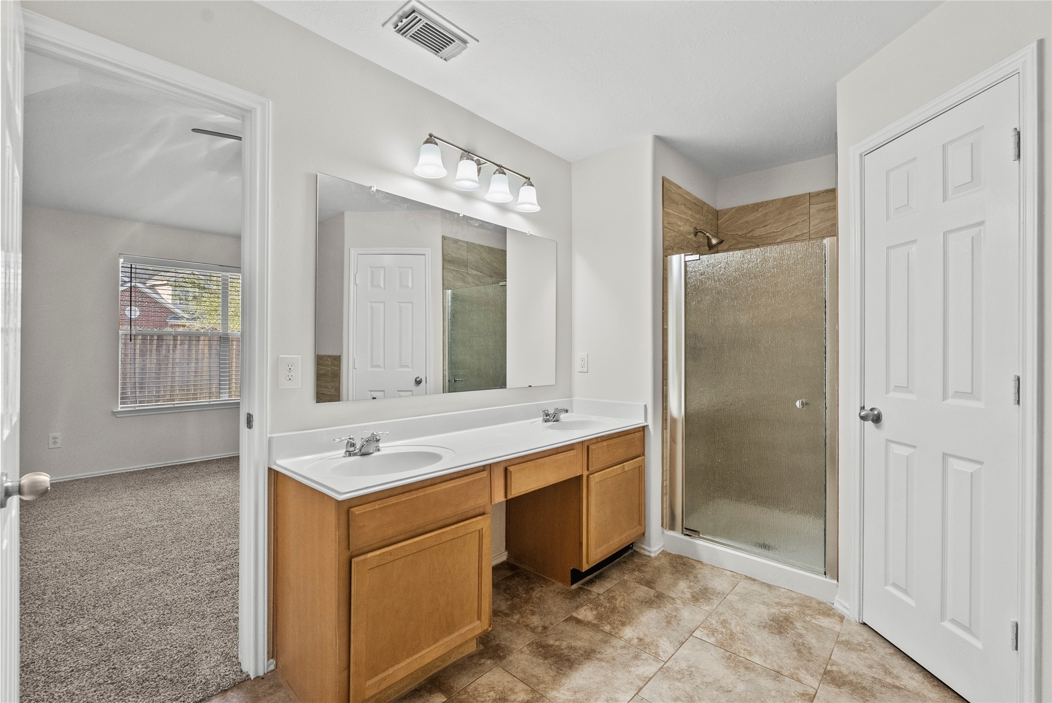 13431 Rural Oak Street Houston, TX 77034 - Photo 6 of 35 primary bathroom with double sinks, tub and shower