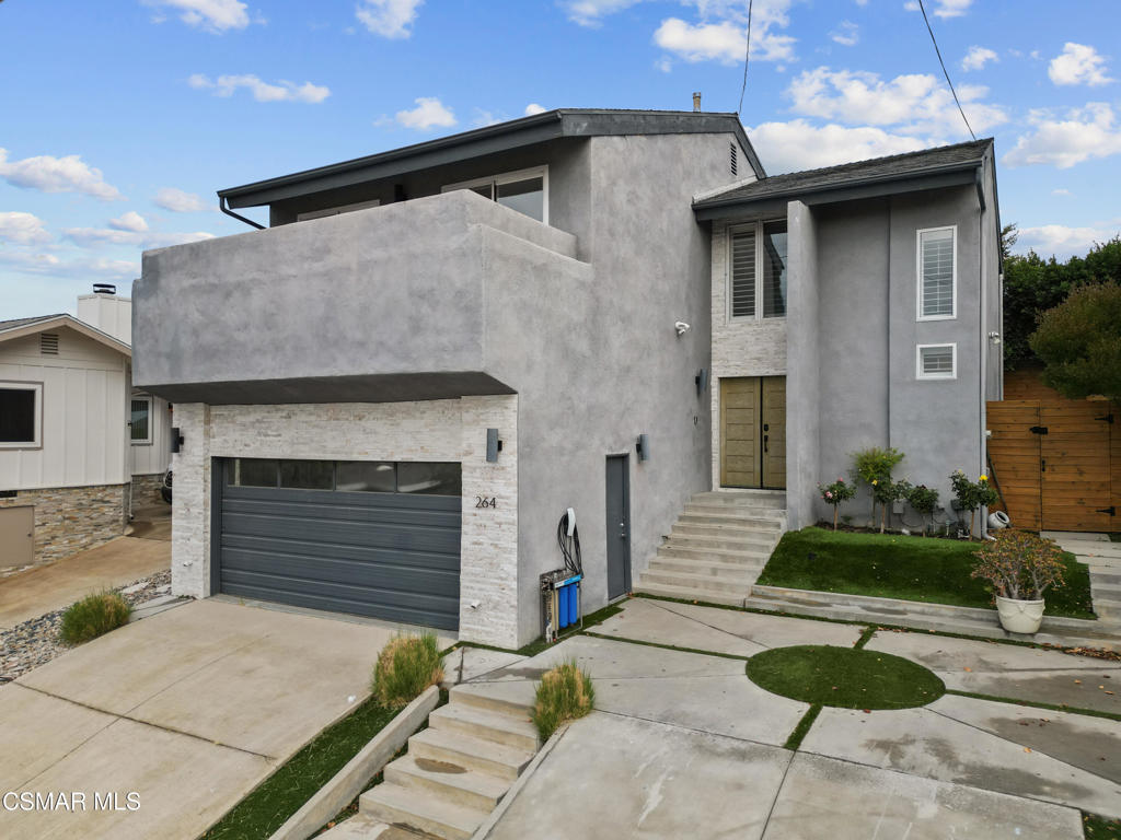 264 Beech Road Newbury Park, CA 91320 - Photo 27 of 29 a brick house with a yard and plants