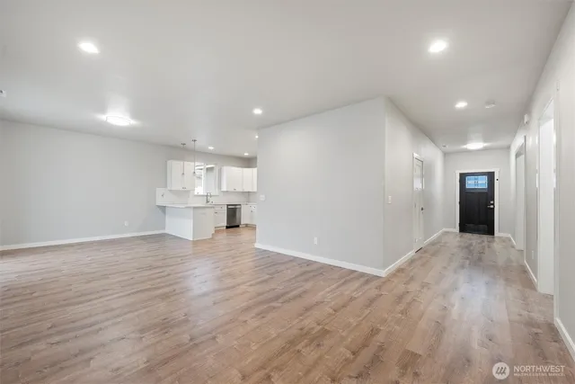 a view of kitchen with refrigerator and window