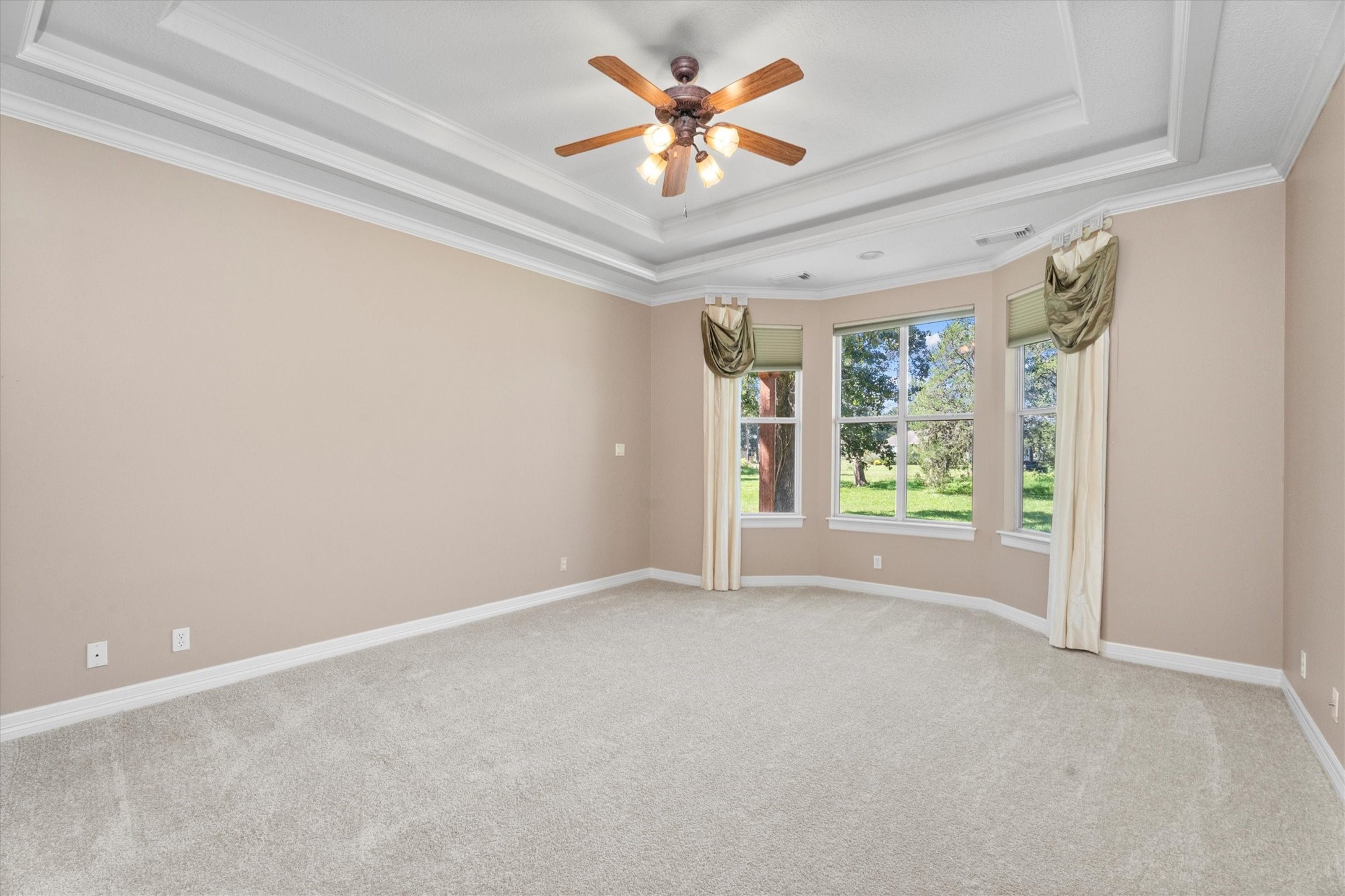 31627 Cedardale Street Magnolia, TX 77355 - Photo 22 of 47 Primary bedroom features fresh paint, brand-new carpet, and abundant natural light creating a serene retreat.