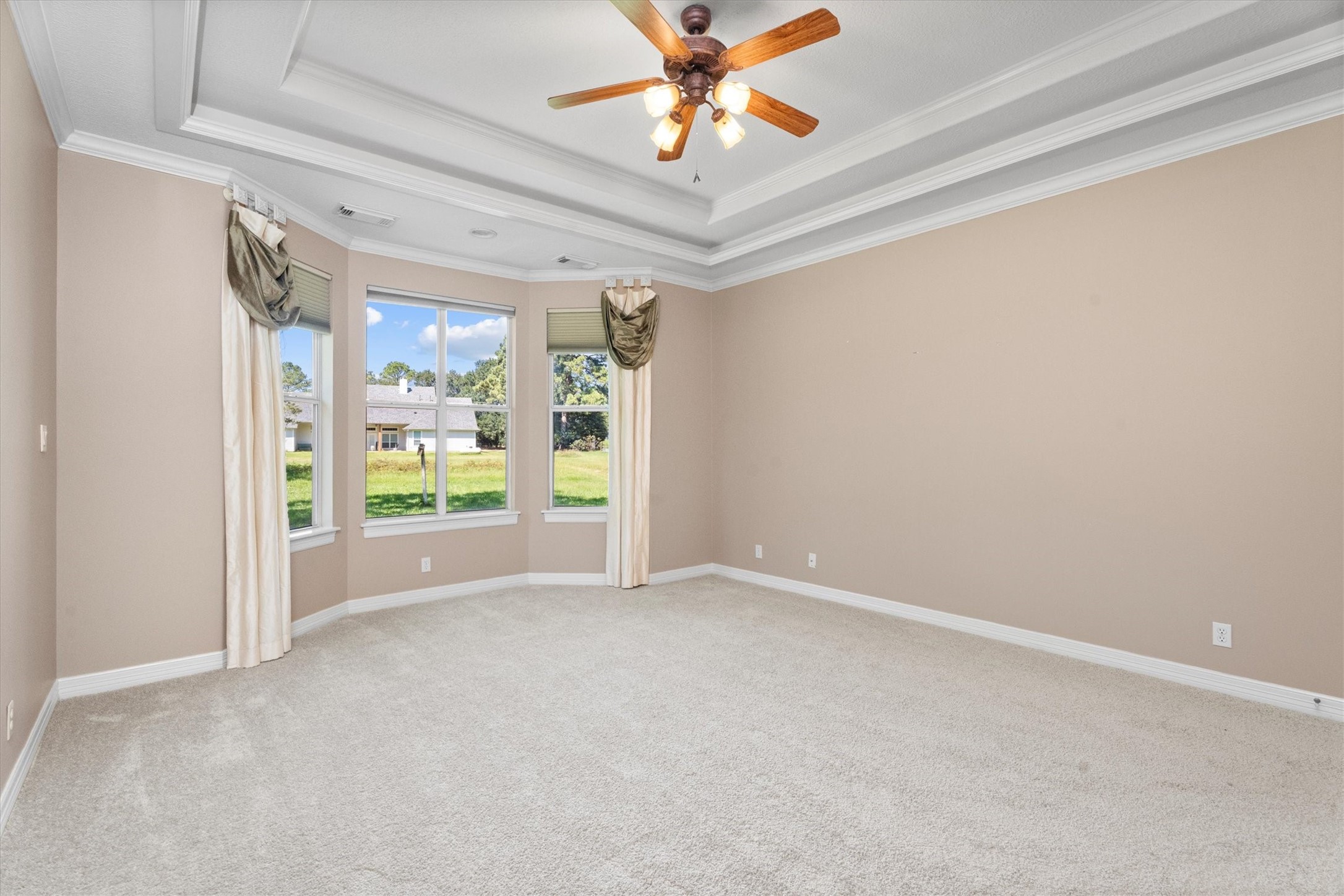 31627 Cedardale Street Magnolia, TX 77355 - Photo 23 of 47 The primary bedroom has bay windows perfect for a sitting area.