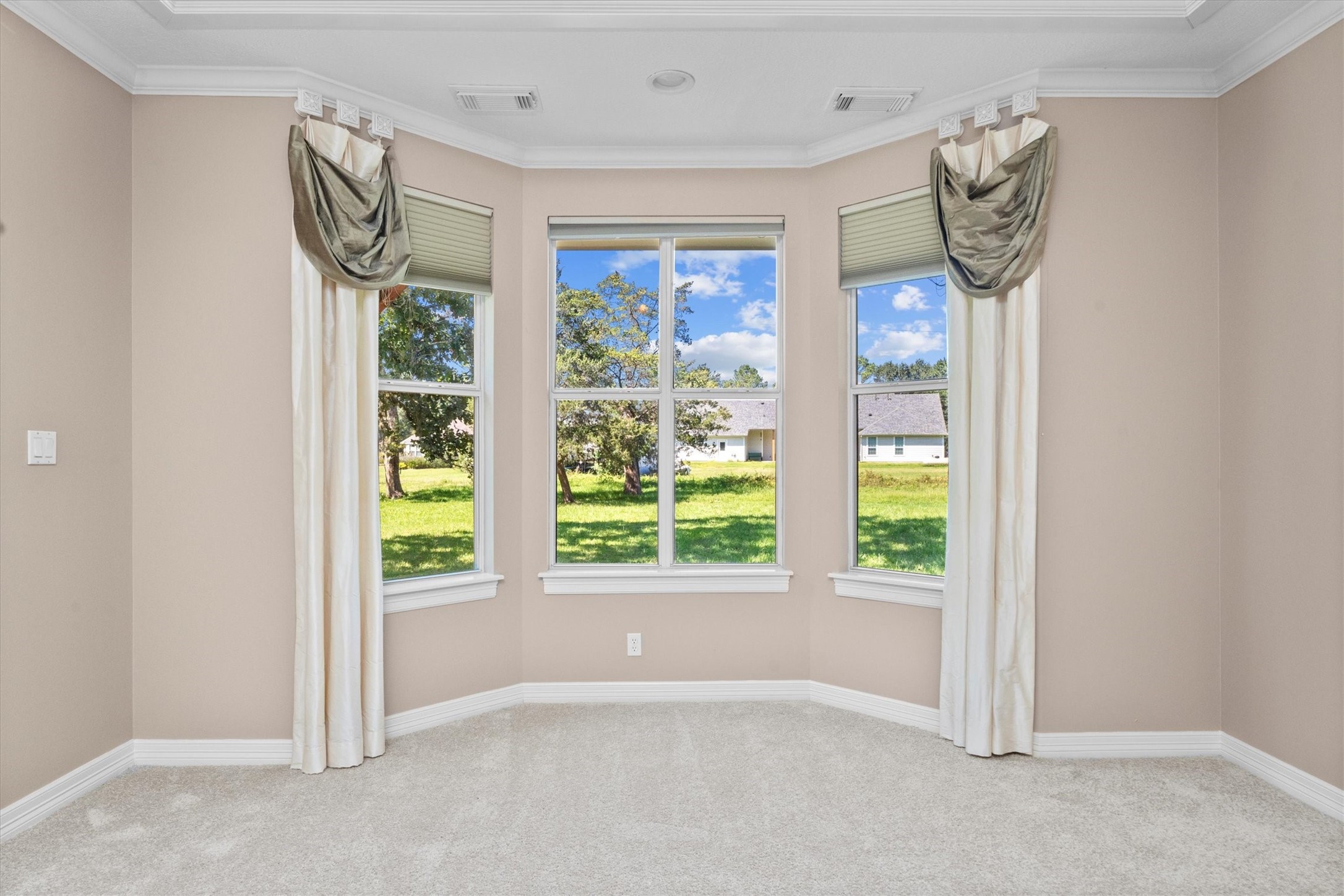 31627 Cedardale Street Magnolia, TX 77355 - Photo 24 of 47 The primary bedroom has bay windows perfect for a sitting area.
