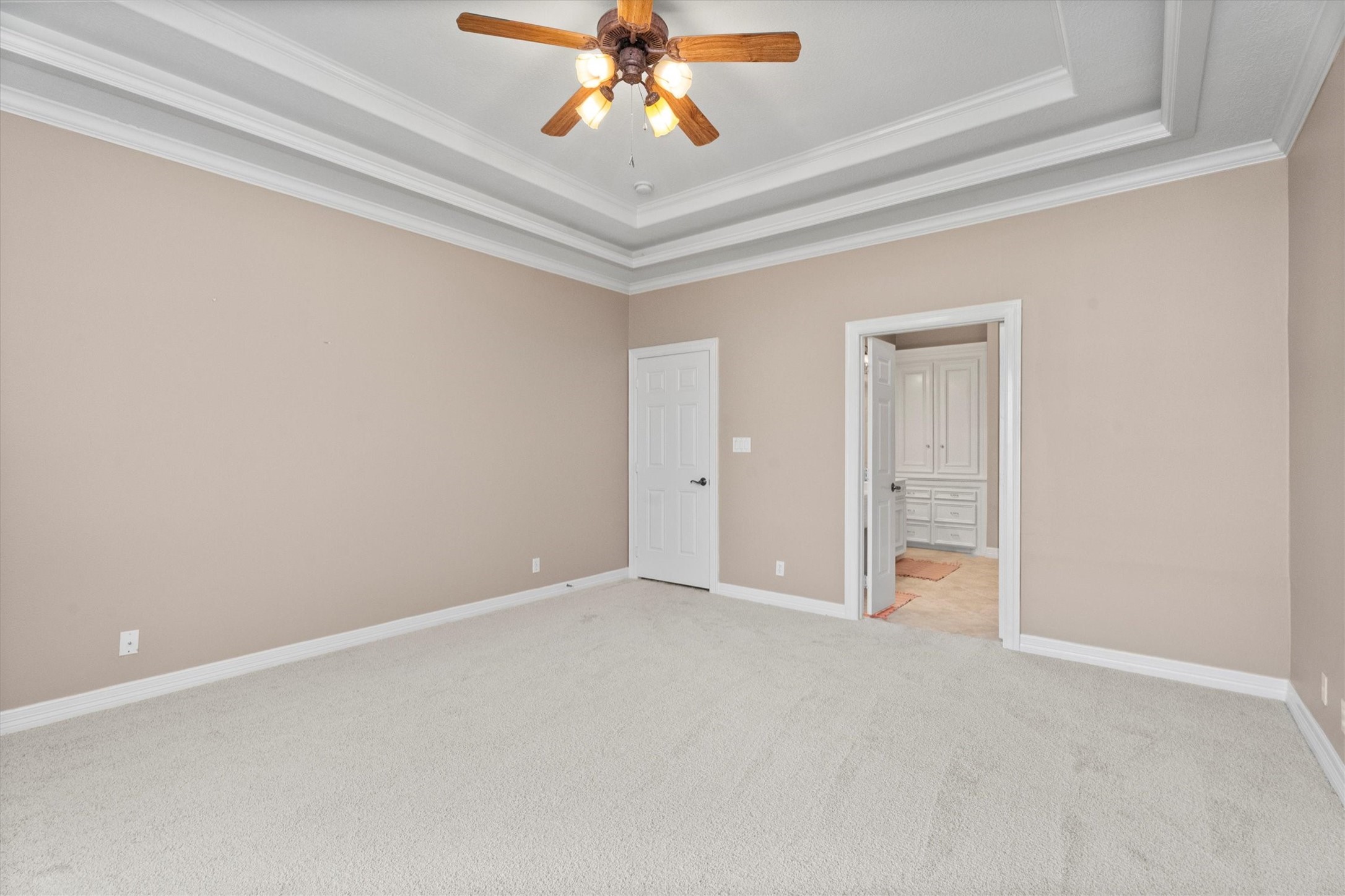 31627 Cedardale Street Magnolia, TX 77355 - Photo 25 of 47 The primary bedroom has tray ceilings and an en-suite bathroom.