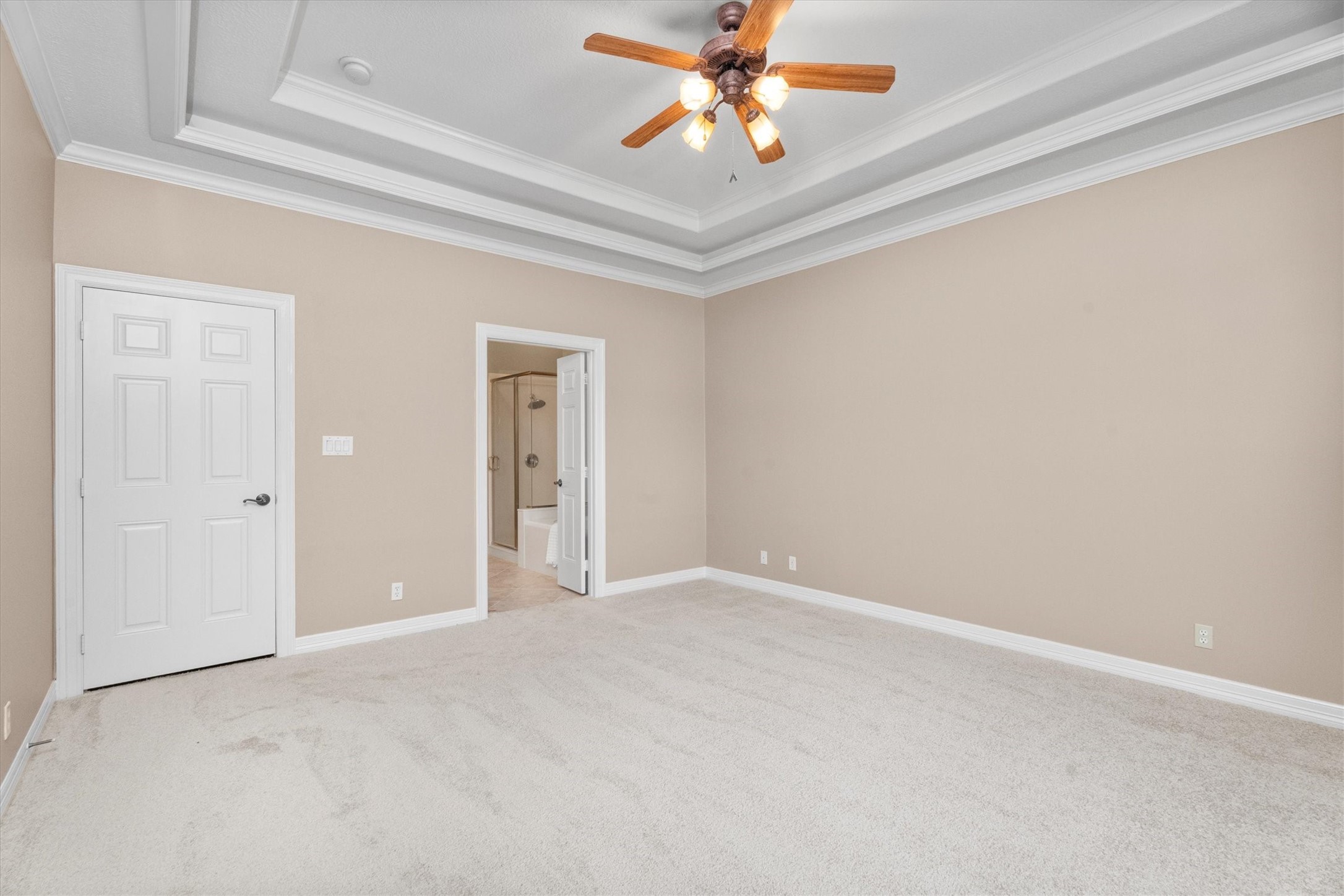 31627 Cedardale Street Magnolia, TX 77355 - Photo 26 of 47 The primary bedroom has tray ceilings and an en-suite bathroom.