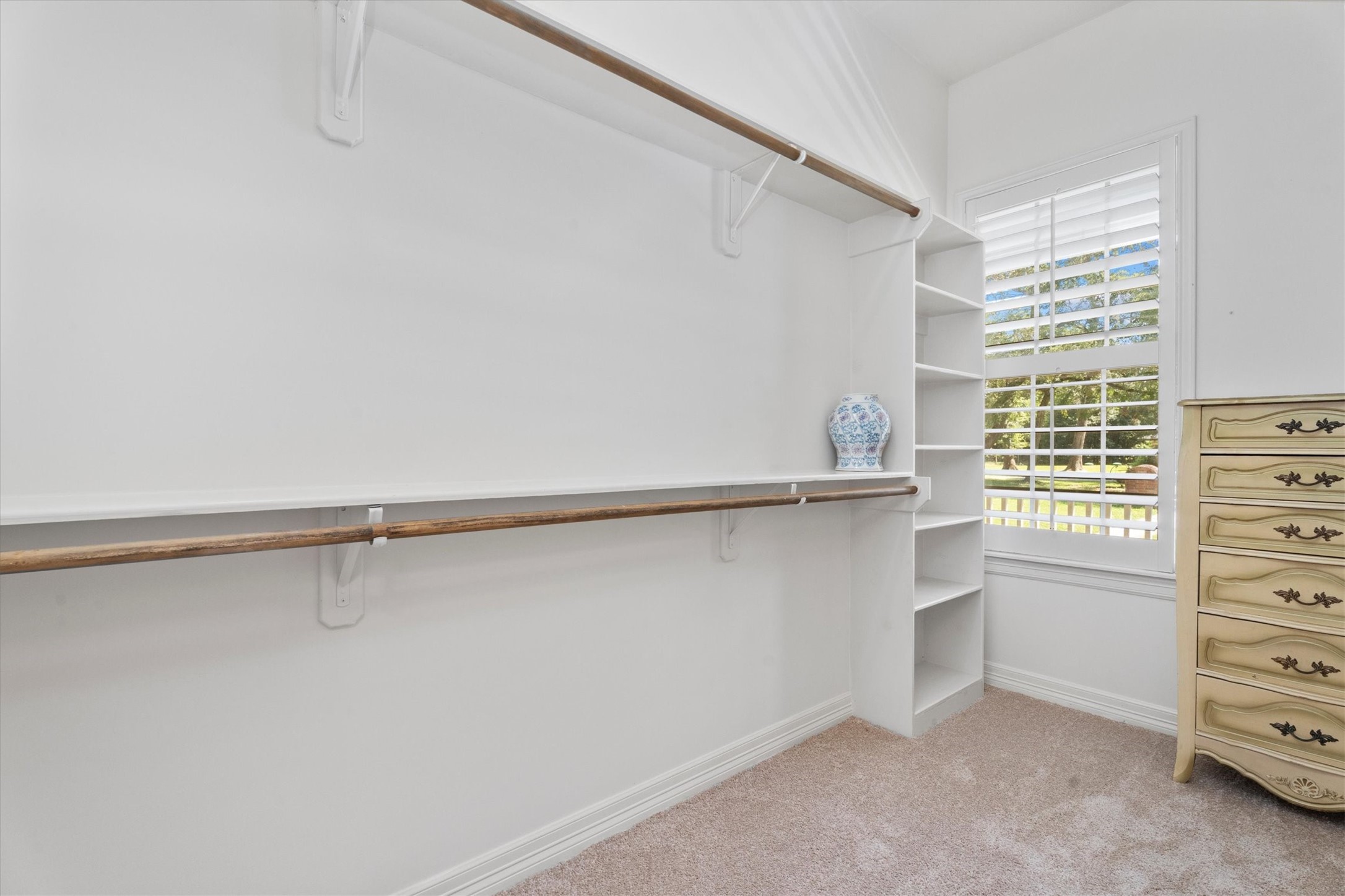 31627 Cedardale Street Magnolia, TX 77355 - Photo 29 of 47 Ample built-ins provide plenty of storage space in the primary walk-in closet.