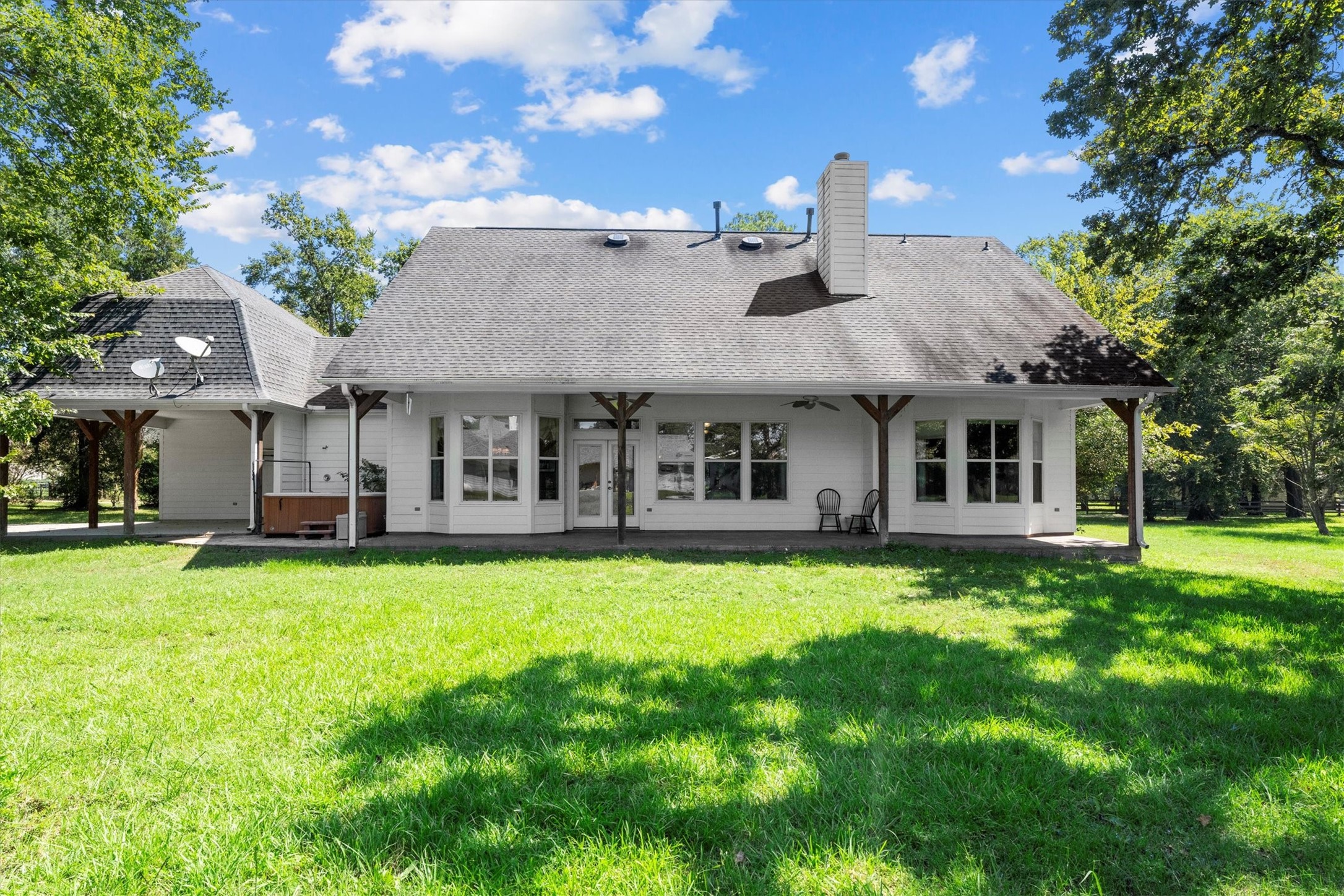 31627 Cedardale Street Magnolia, TX 77355 - Photo 43 of 47 Covered patio with plenty of room for grilling, dining, and enjoying the outdoors.