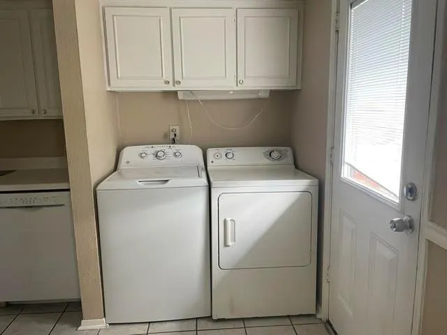 a utility room with dryer and washer