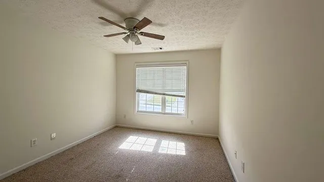 an empty room that has a window in it