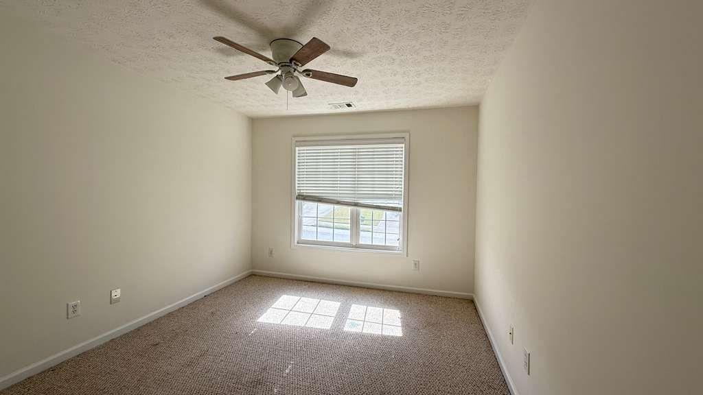 3860 Morgan Road Buford, GA 30519 - Photo 16 of 21 an empty room that has a window in it